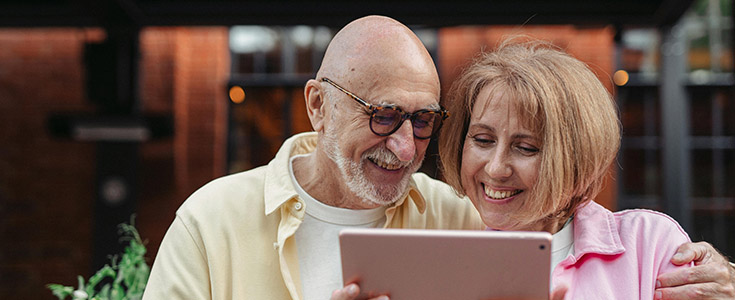 Happy couple on tablet